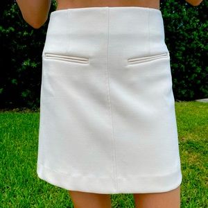 Chelsea 28 ivory A-line mini skirt w back zipper.  Like new no tags XXS